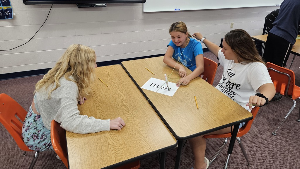 Drawing with strings attached to markers