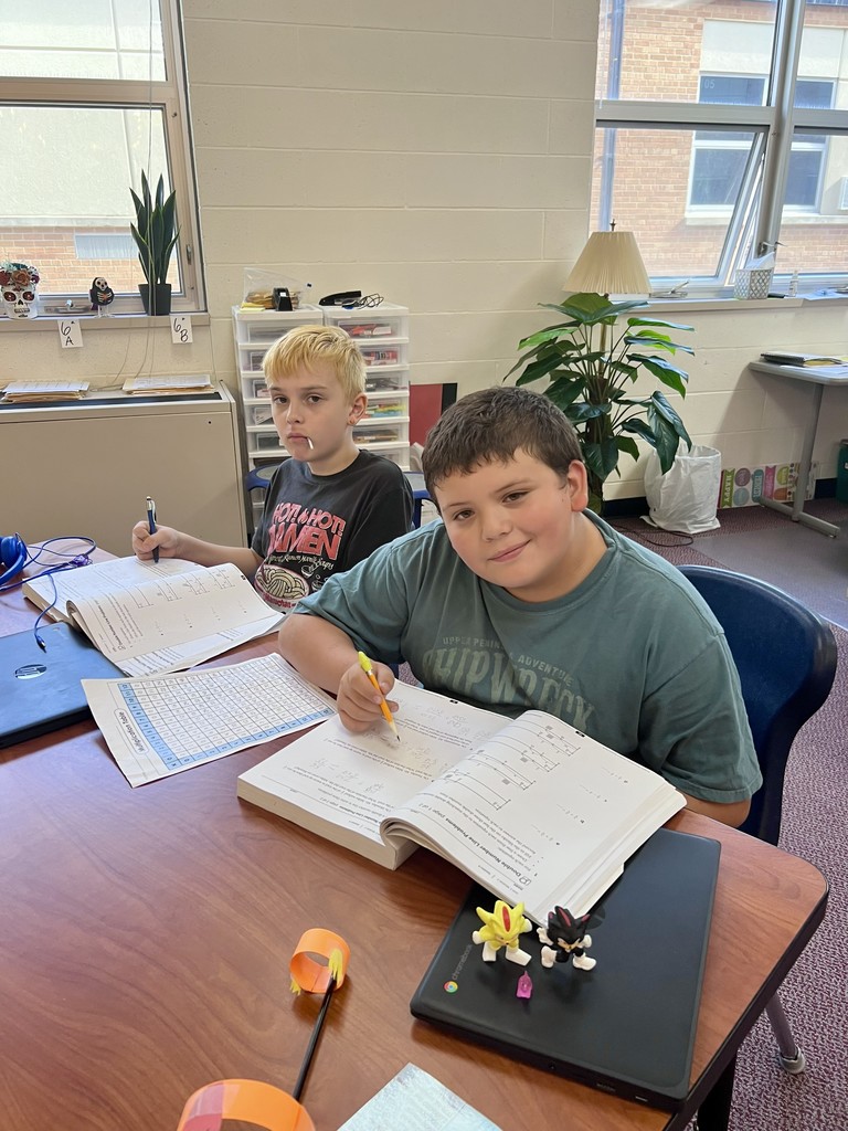 Friends figuring out math problems.