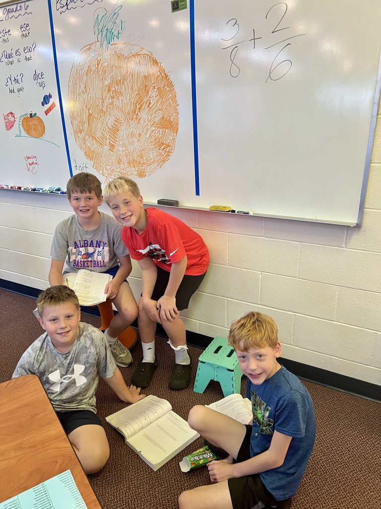 Boys working together at the board.
