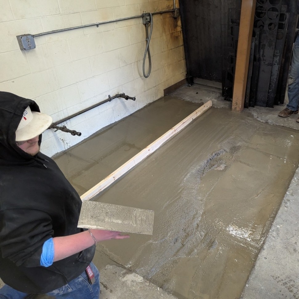 Screeding concrete