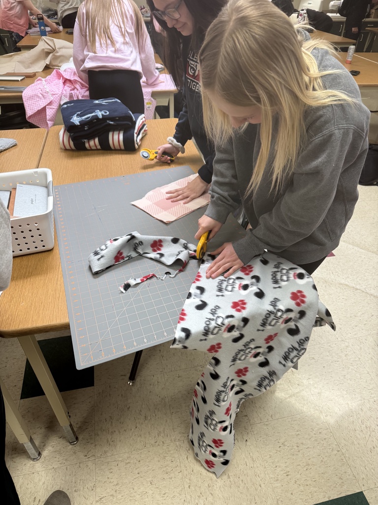 Cutting their pieces out. 