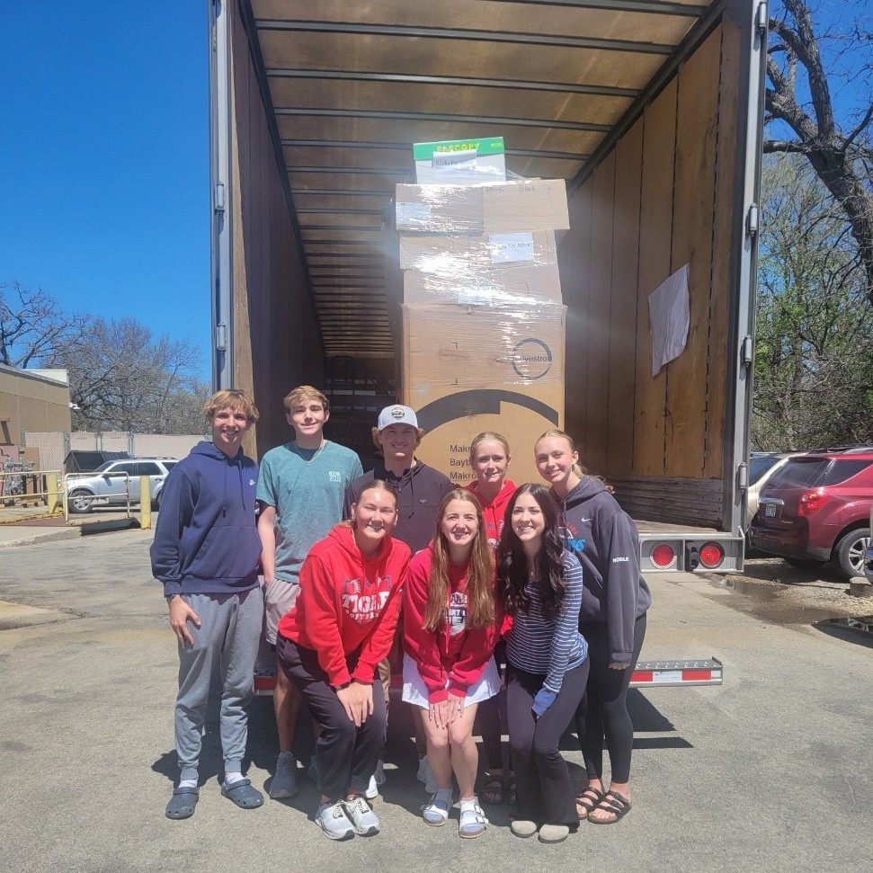 Our NHS officer team representing the NHS students at the loading of the books! 