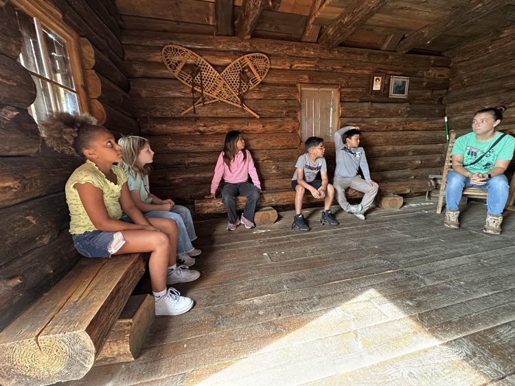 students learning about log cabins