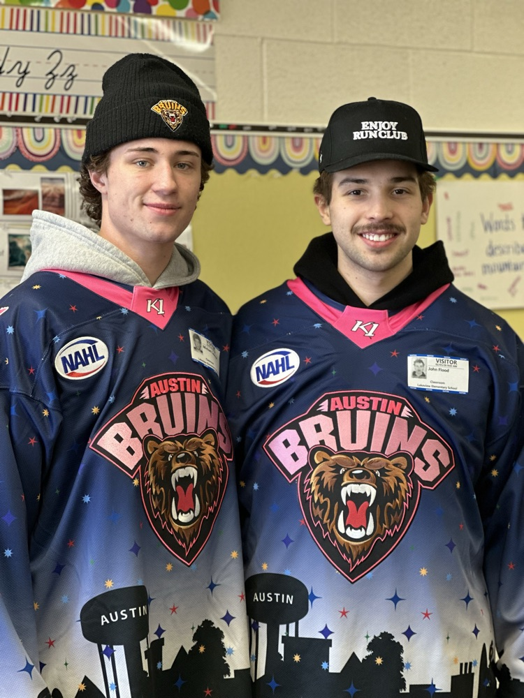 Austin Bruins players reading to elementary students. 