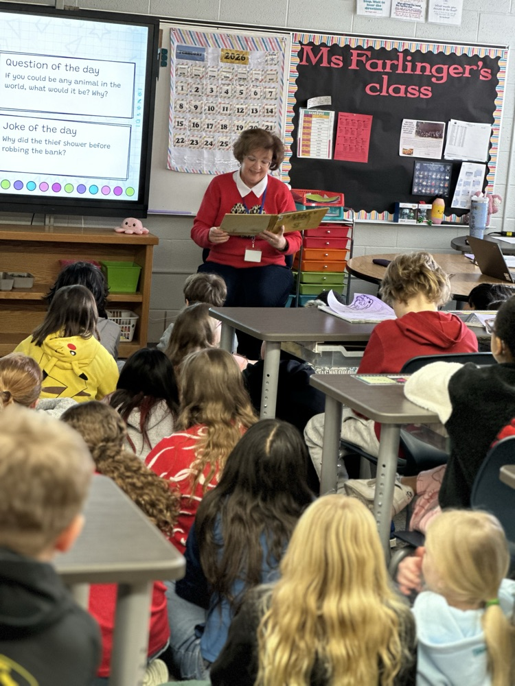 Mary Jo Dorman reading to elementary students. 