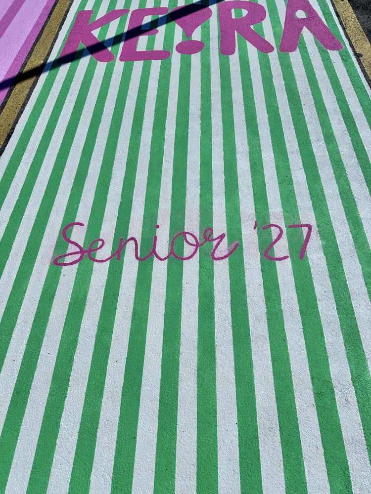 ALHS seniors painting their parking spaces. 
