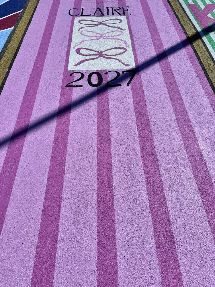 ALHS seniors painting their parking spaces. 