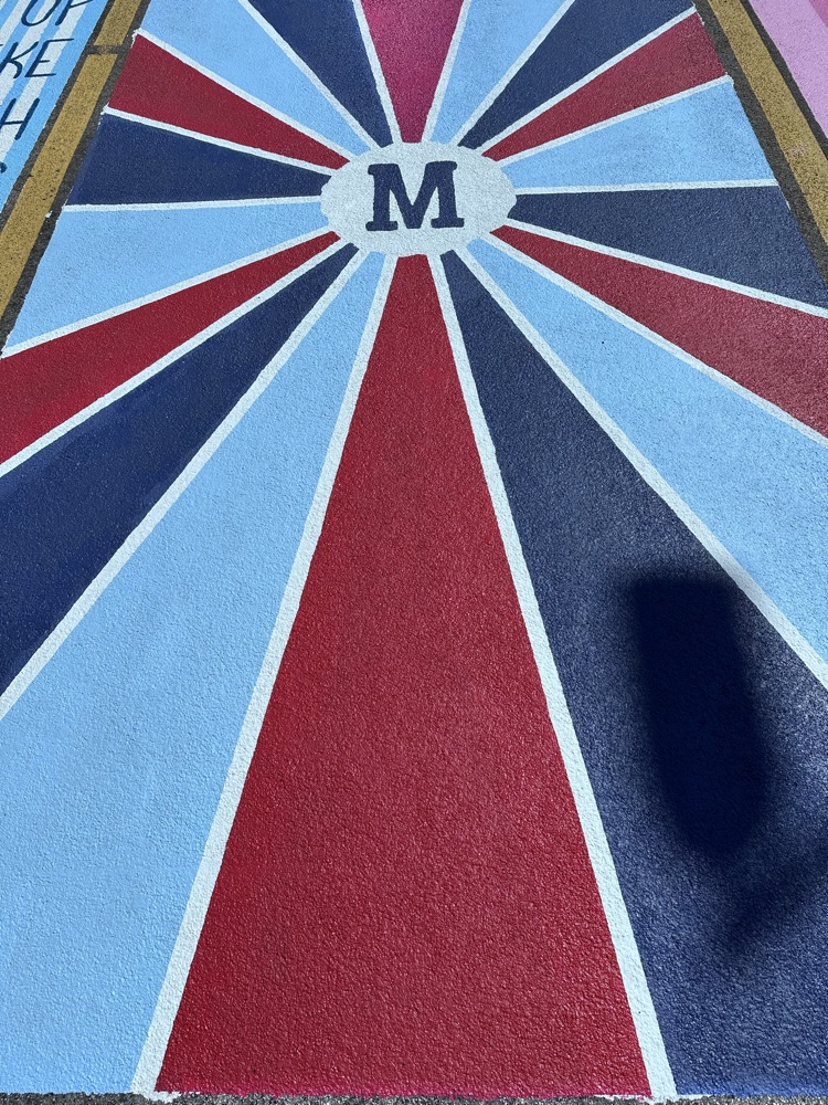 ALHS seniors painting their parking spaces. 
