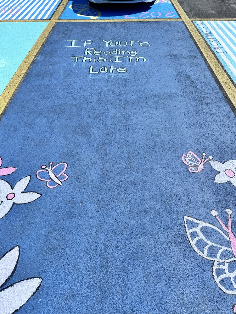ALHS seniors painting their parking spaces. 