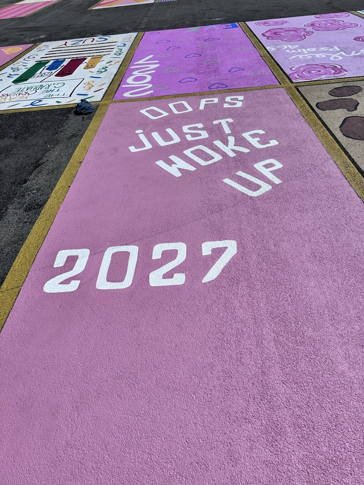 ALHS seniors painting their parking spaces. 