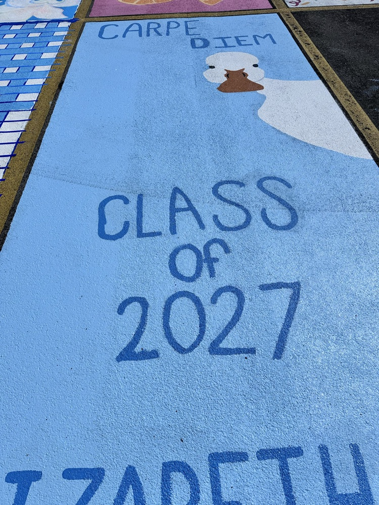 ALHS seniors painting their parking spaces. 