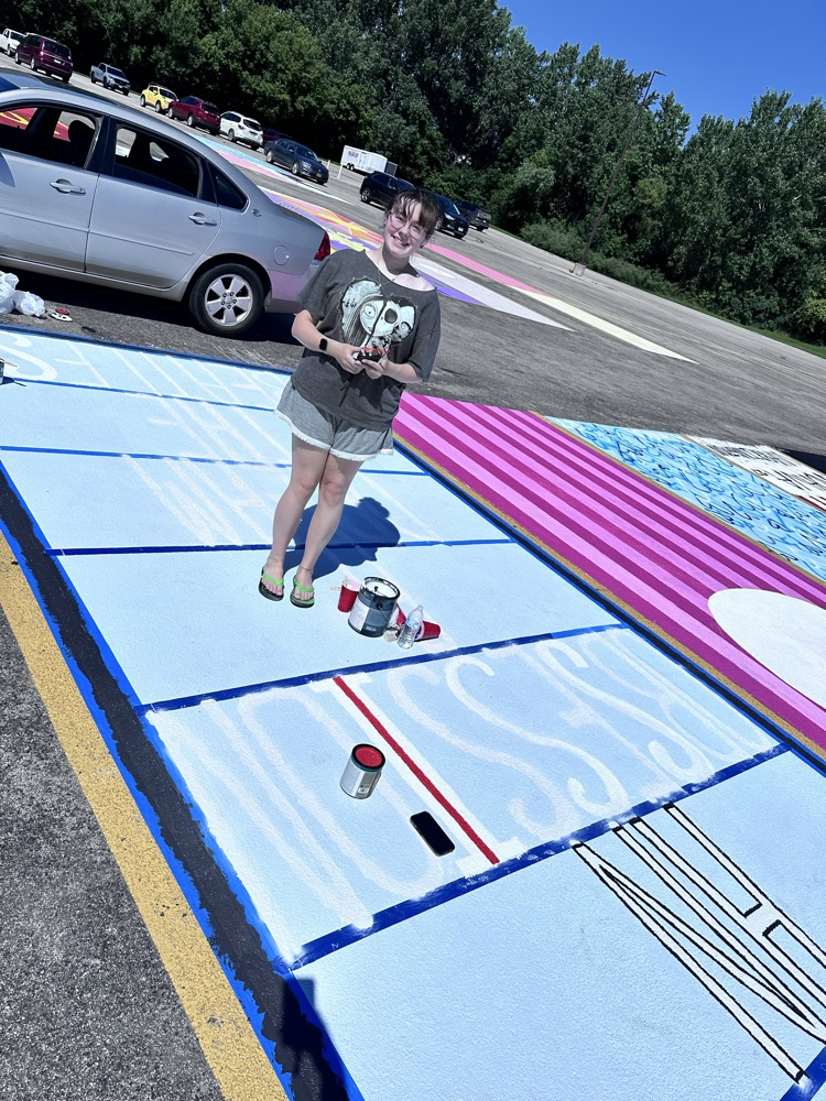 ALHS seniors painting their parking spaces. 