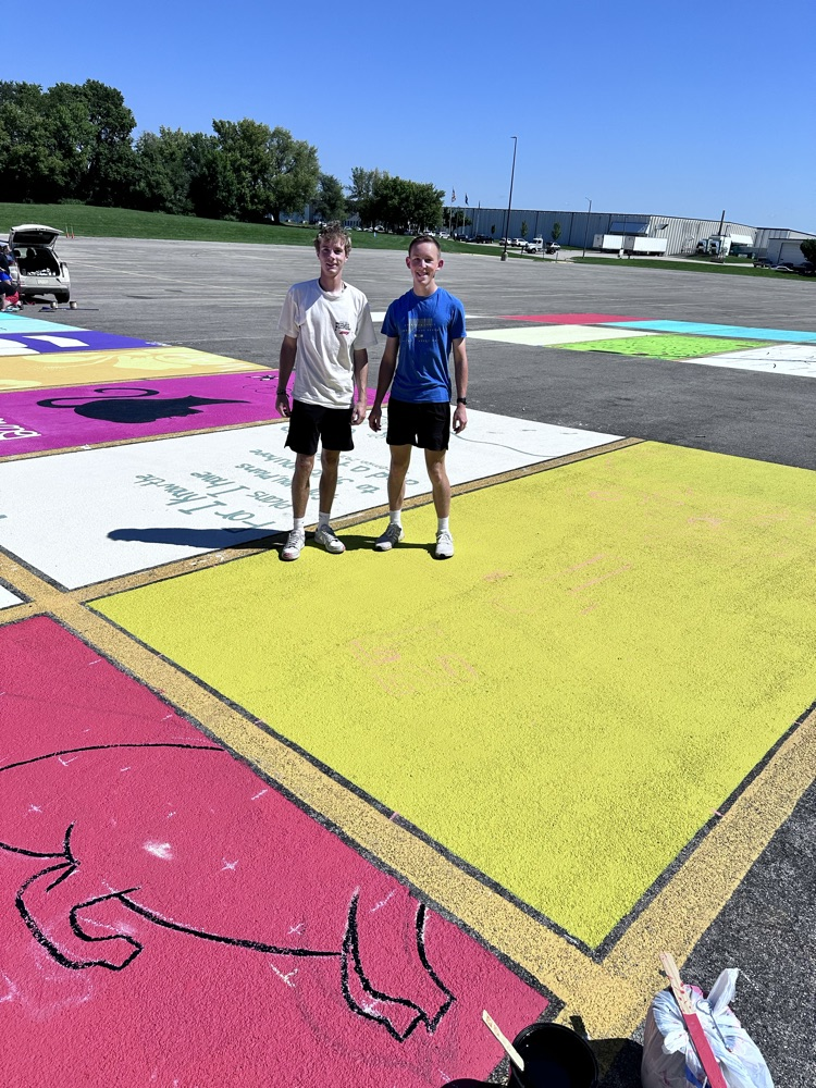 ALHS seniors painting their parking spaces. 