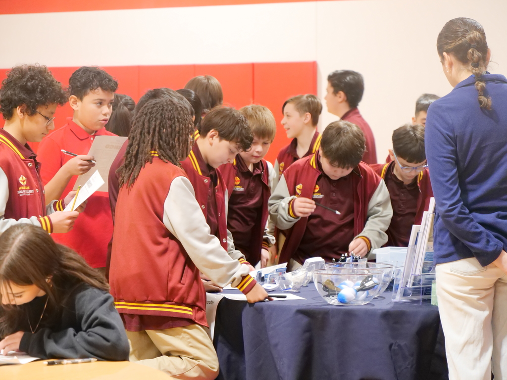 Students engaging with one of the booths