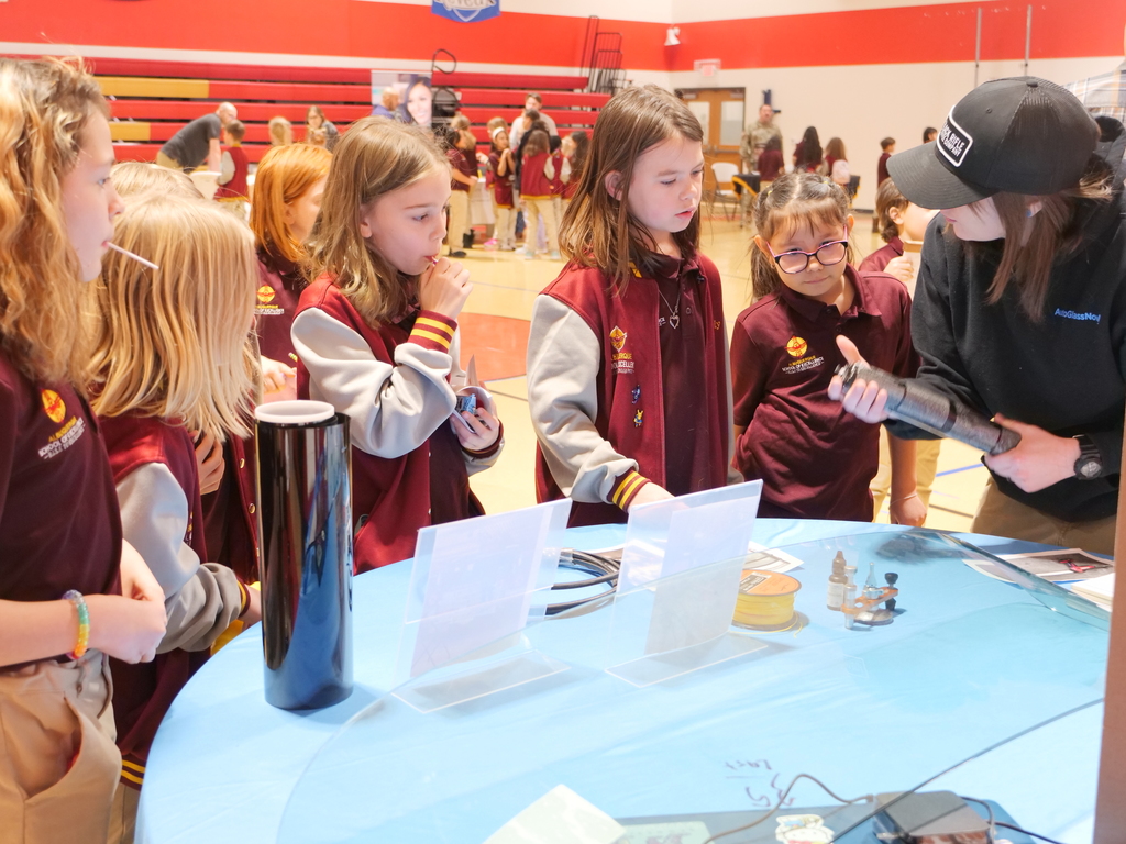 Students at windshield glass booth