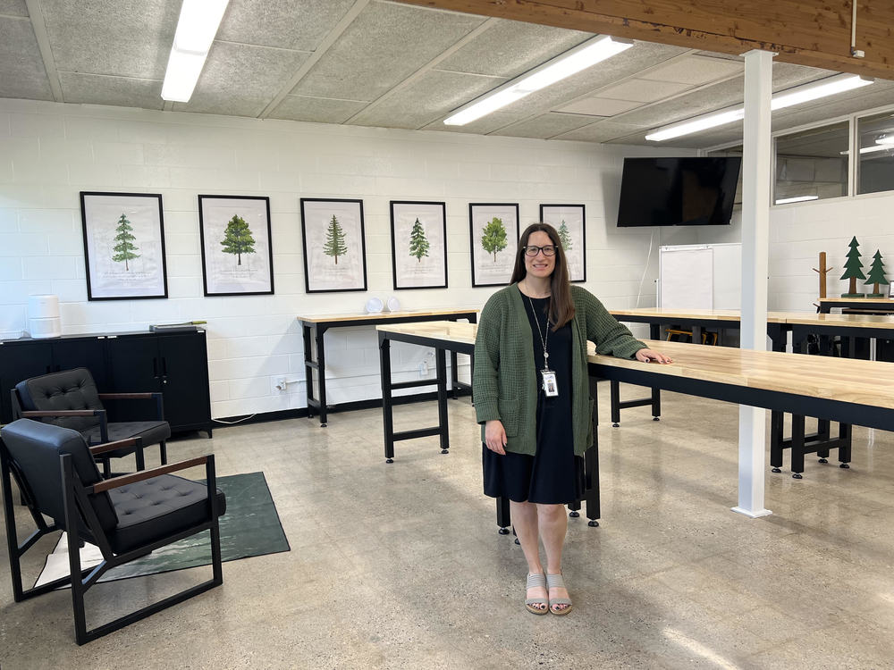 Helen-Ann Cordes, ACS Early College Program Coordinator, in her new Early College Recharge Room. This classroom space was made possible through the help of volunteers, ACS staff, and an MCAN Innovative Program Grant. The room will be used for Early College students to study, take college exams, host workshops for students and families, conduct weekly seminars with Early College students, and more.