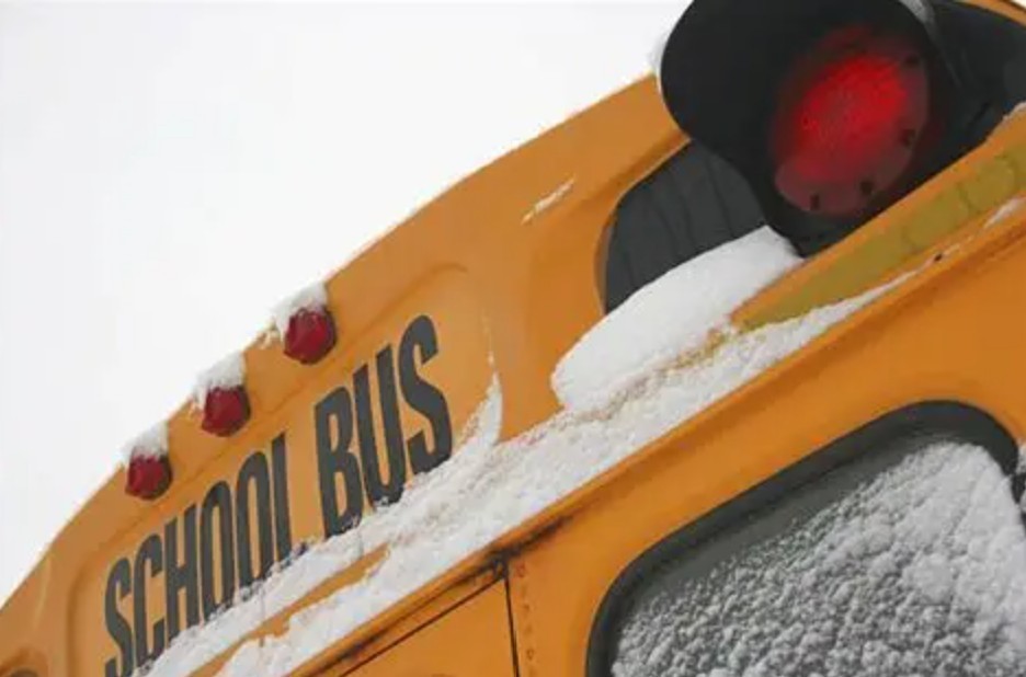 picture of the back of a school bus with snow on it
