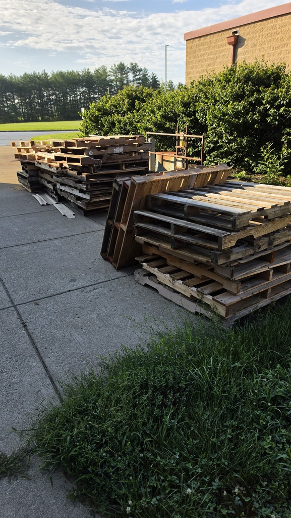 picture of a pile of wood pallets on the our loading dock