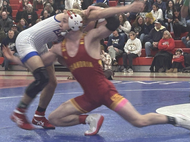 Jayden McPhearson takes a “shot” on an Elwood wrestler. 