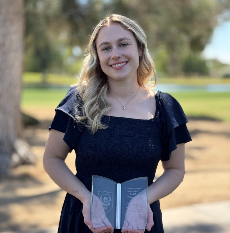 Jennifer Martinez hold Hero Maker Award