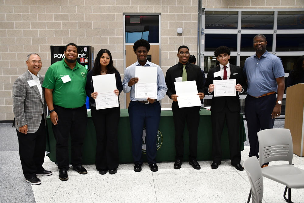 Group of students receive scholarships.