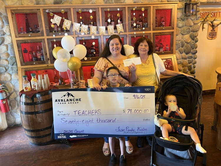 Mrs. Beiza and family receiving a check from Avalanche Group to support our Martin Mustangs