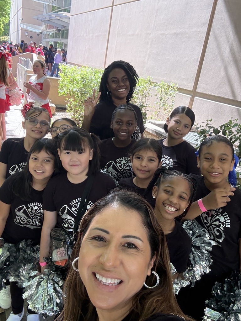 Martin's Cheer Team showing their skills during a Rockets halftime show