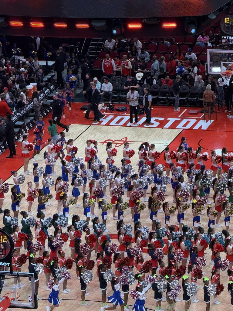 Martin's Cheer Team showing their skills during a Rockets halftime show