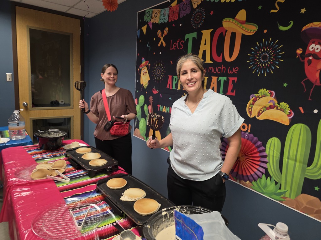 2 women serving pancakes at school
