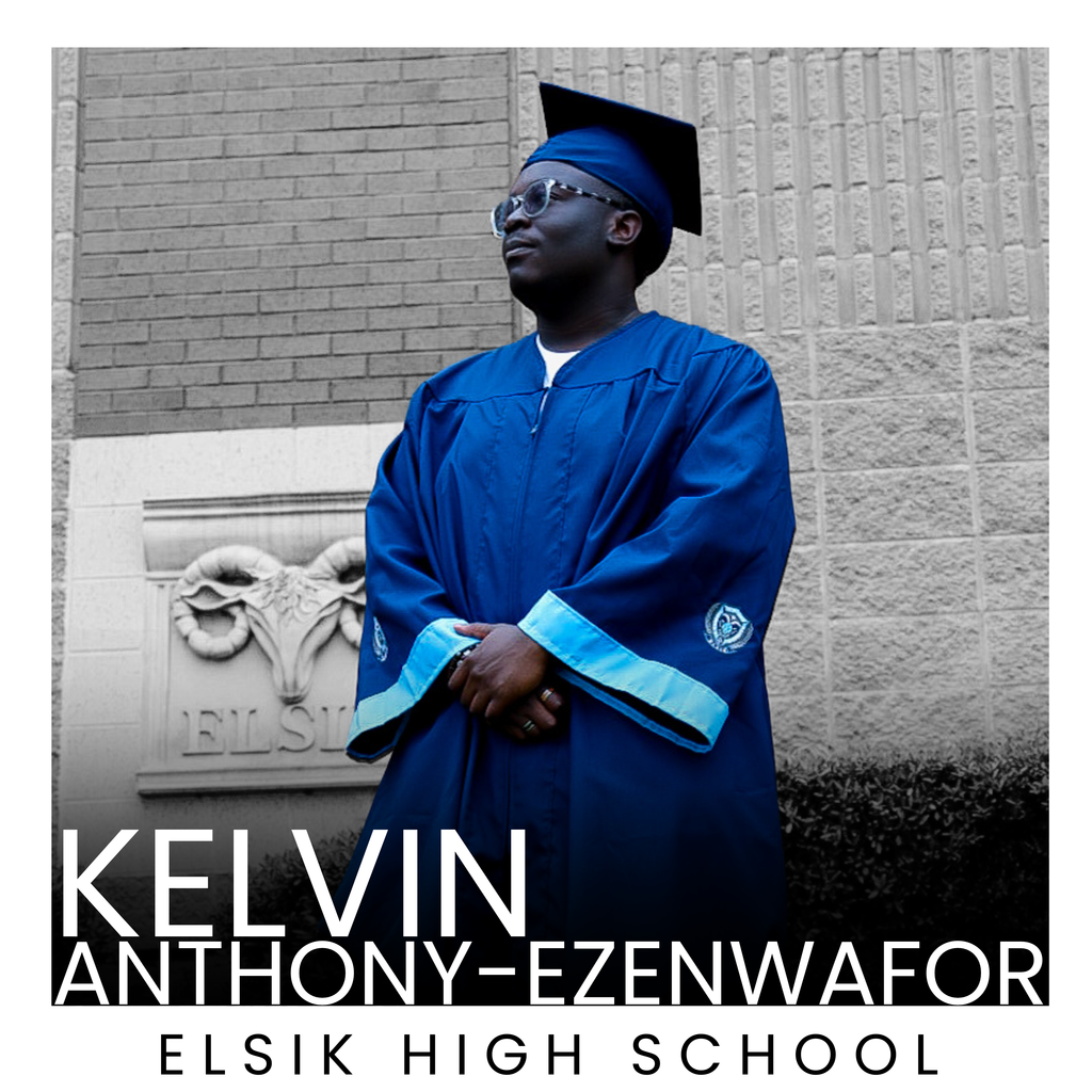 A young man in a blue graduation gown and cap stands in front of a brick wall with text.