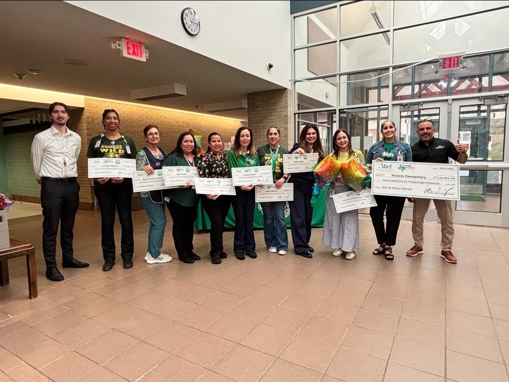TIA Teachers holding their checks