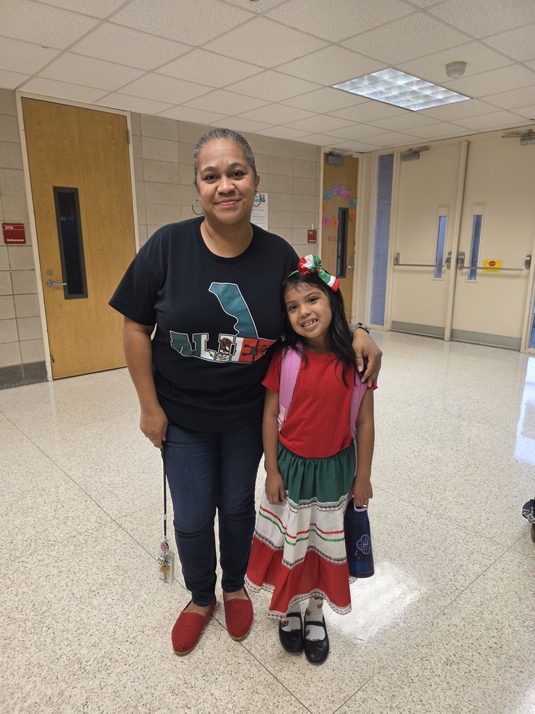 Teacher and student in Hispanic attire