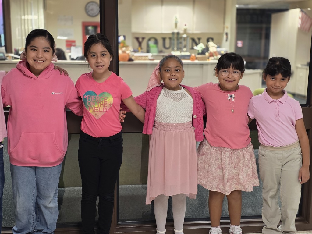 Students wearing pink attire to show breast cancer awareness