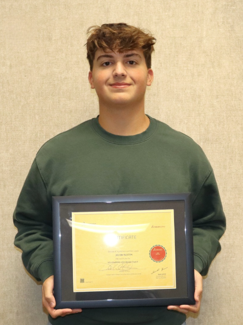 Jacob Austin posing with certificate