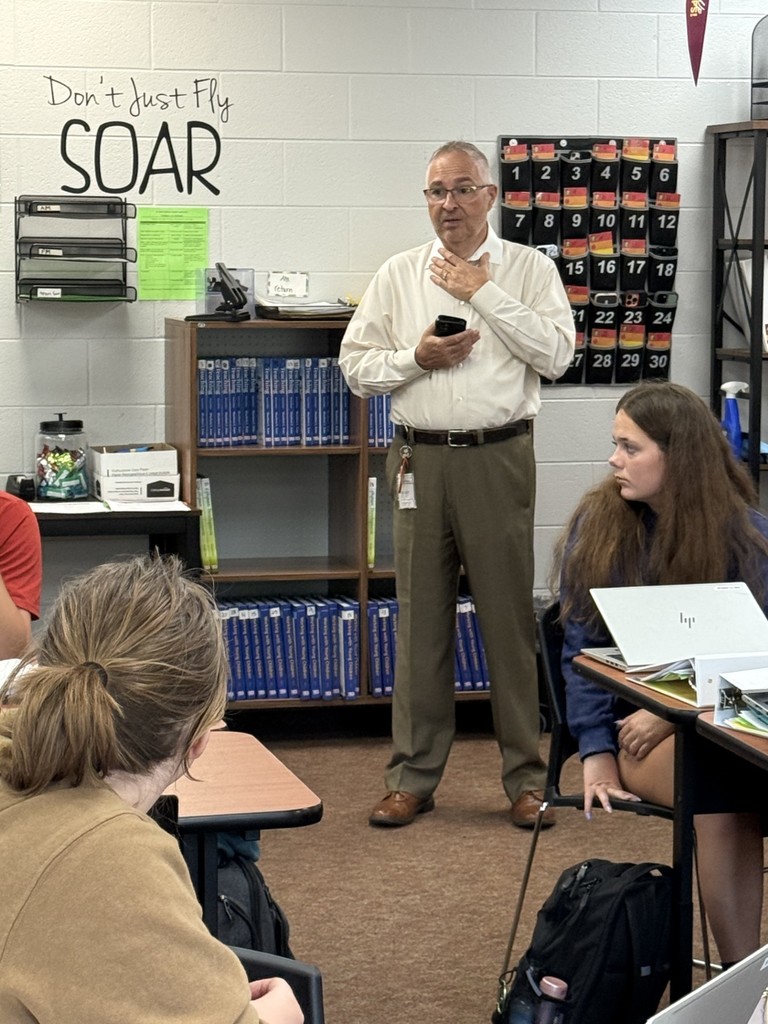 Superintendent William Brown speaks to classroom of students