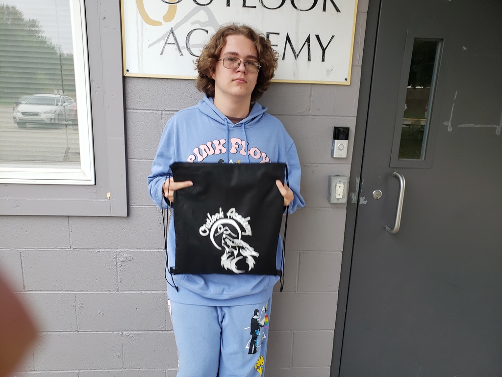 picture with Xander N. as student of the week at Outlook Academy.  For the week of September 22nd through September 26th.