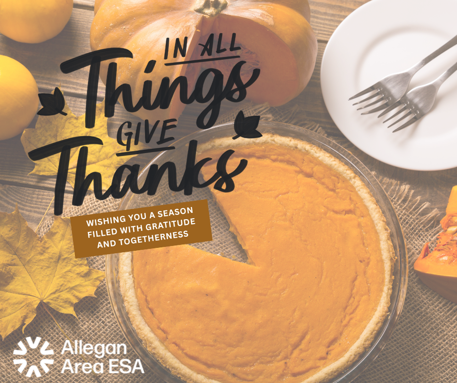 In all things give thanks. Pie sitting on table with pumpkins and leaves, plate and forks