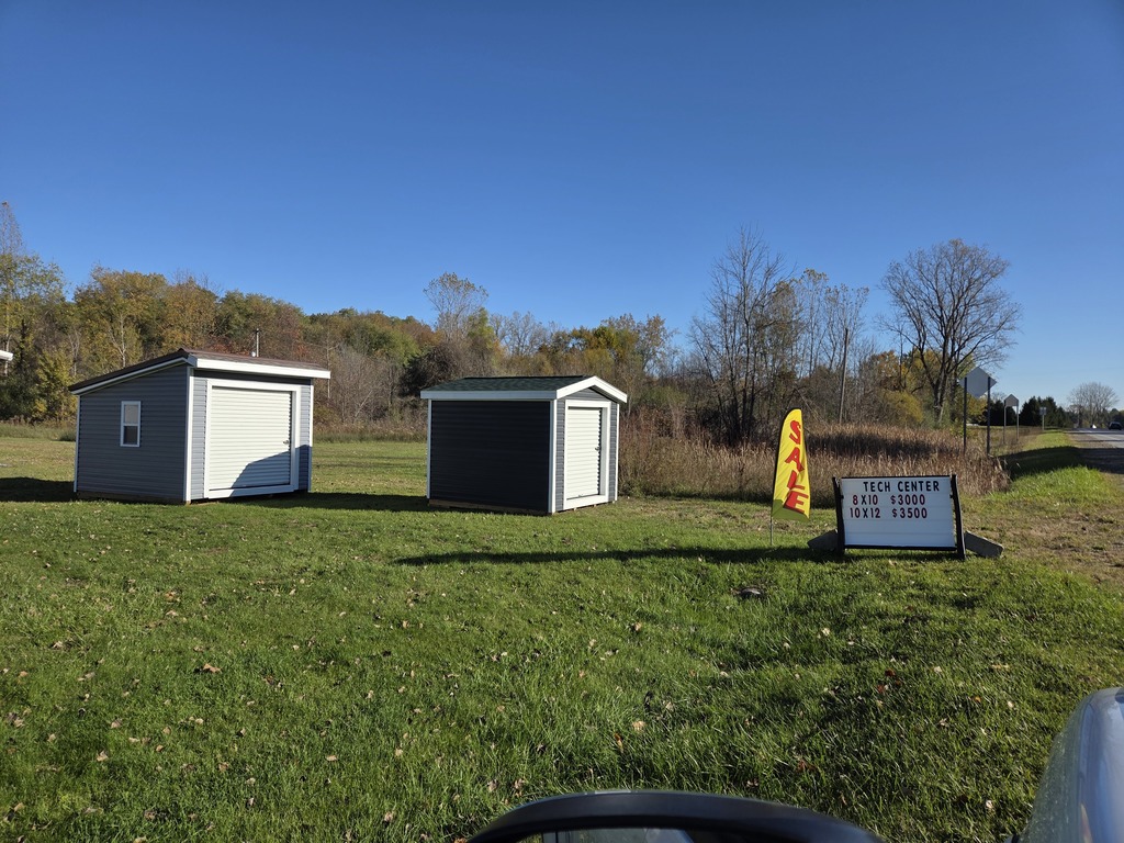 Photo of the two sheds that are available. They are located outside of the Tech Center, to the East of the Outlook Academy building on the roadside.