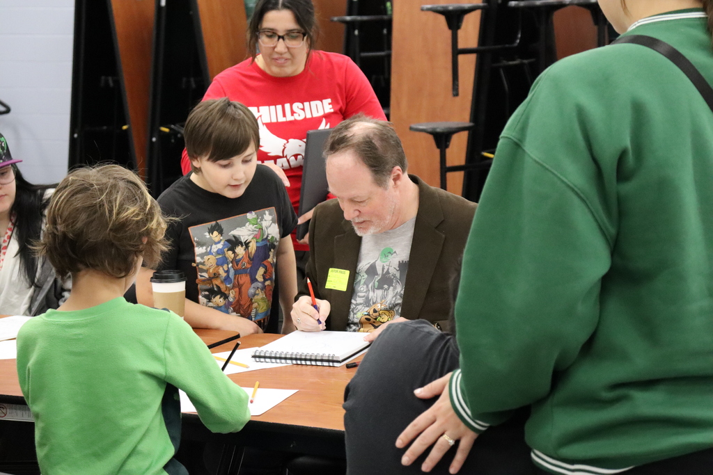 A student is memorized by Brad drawing him on paper