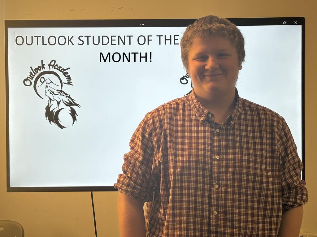 A picture of Bobby as student of the month at Outlook Academy