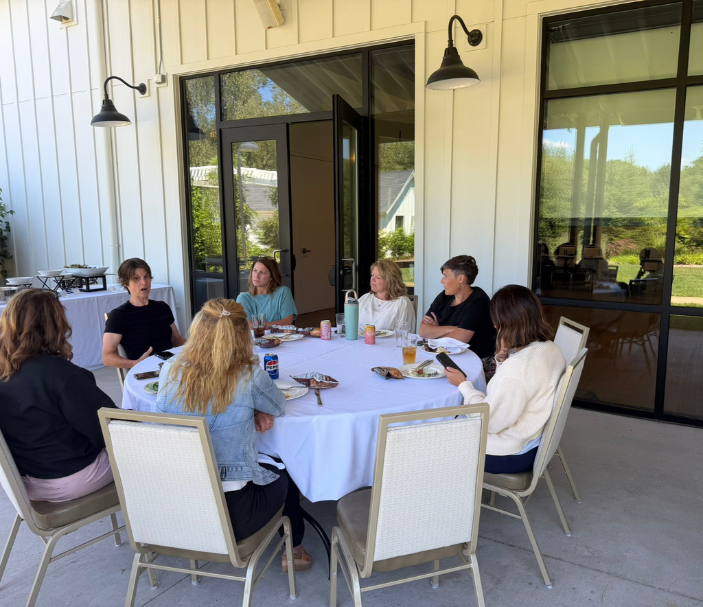 ad council members talk over lunch.