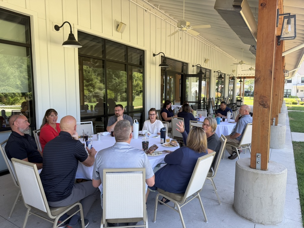 ad council members talk over lunch. 