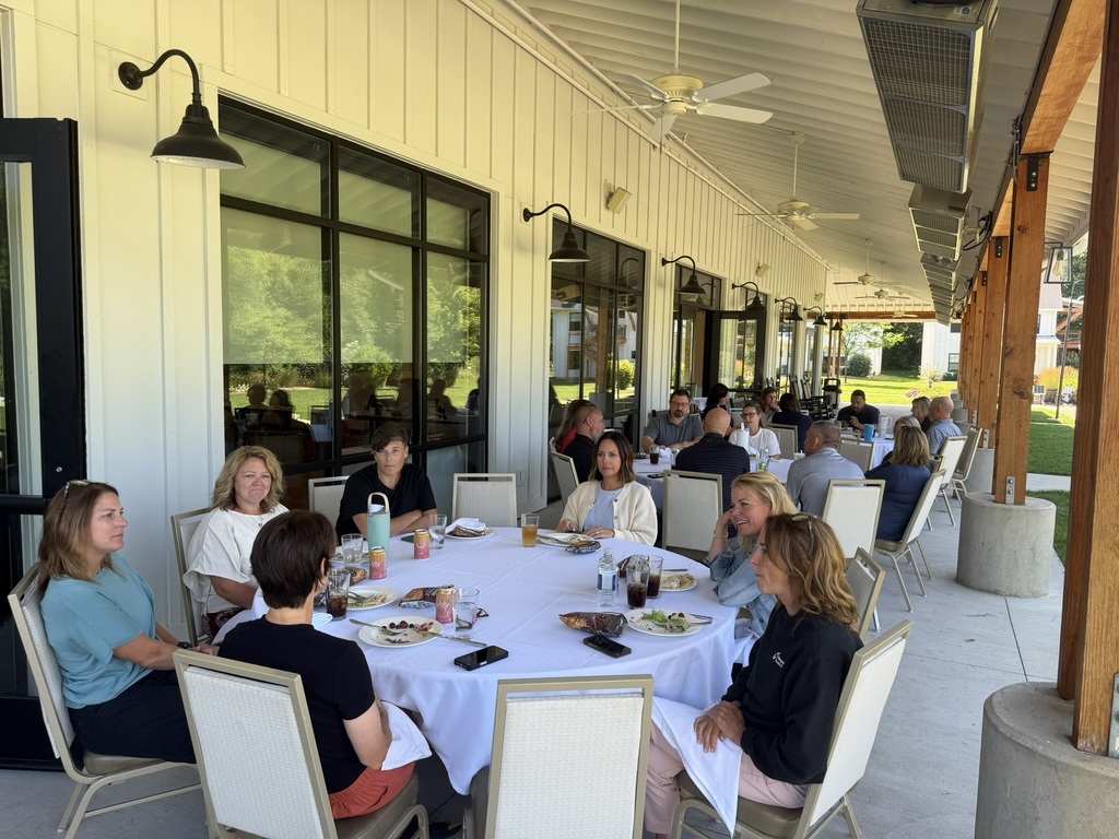 ad council members talk over lunch. 
