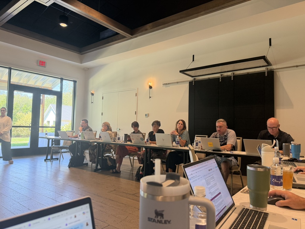 ad council member work on their computers during the annual ad council retreat. 