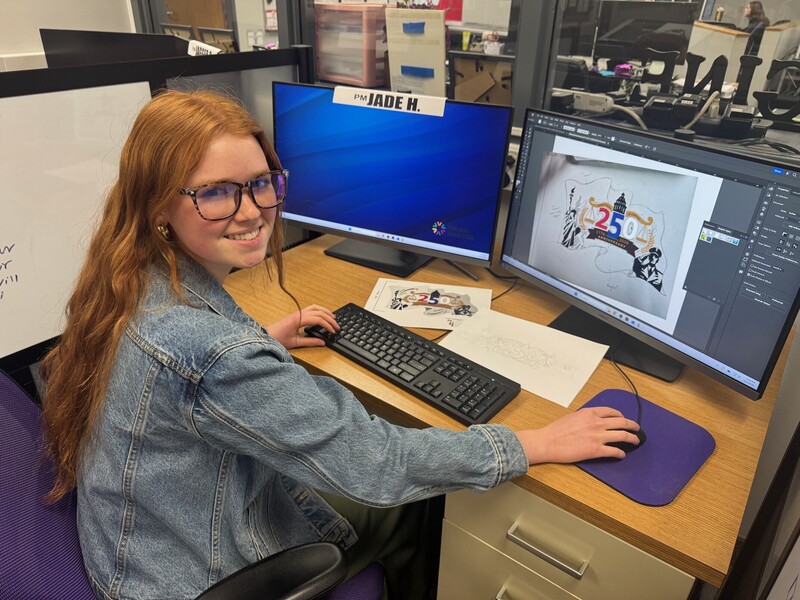 student works on design