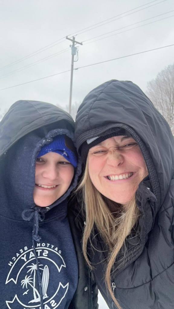 students playing in the snow