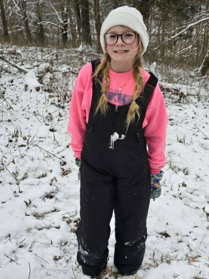 students playing in the snow