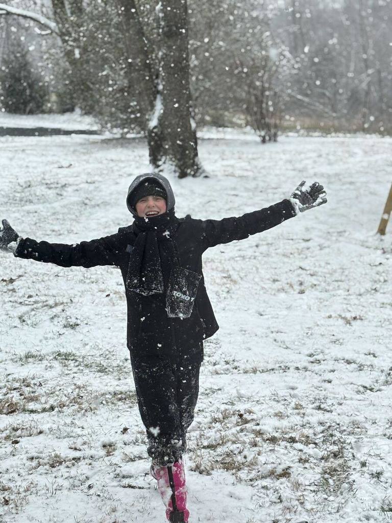 students playing in the snow