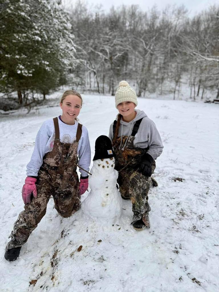 students playing in the snow