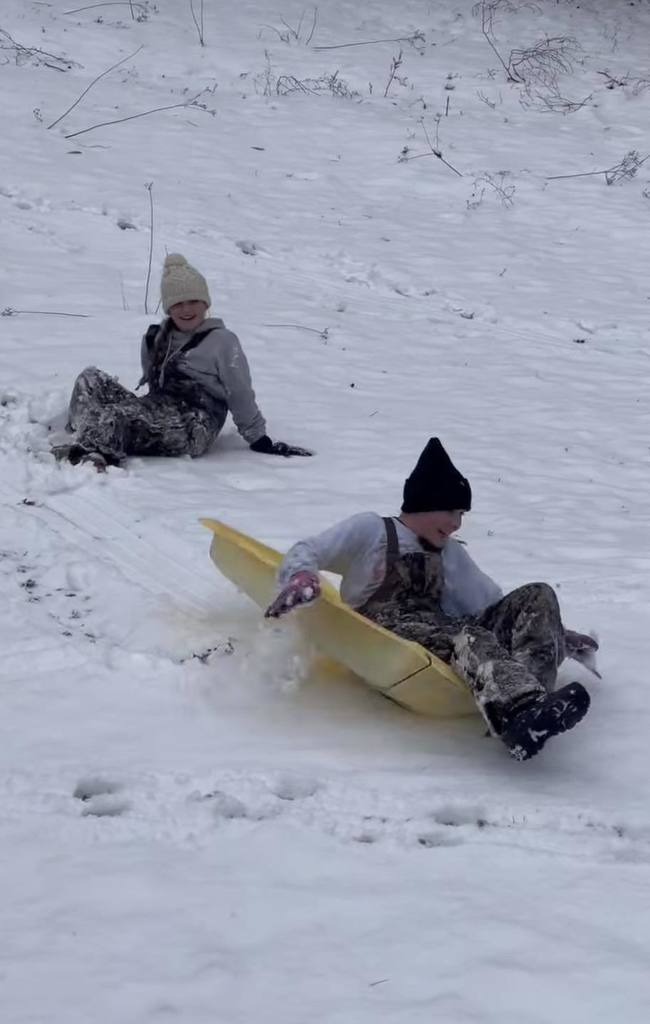 students playing in the snow